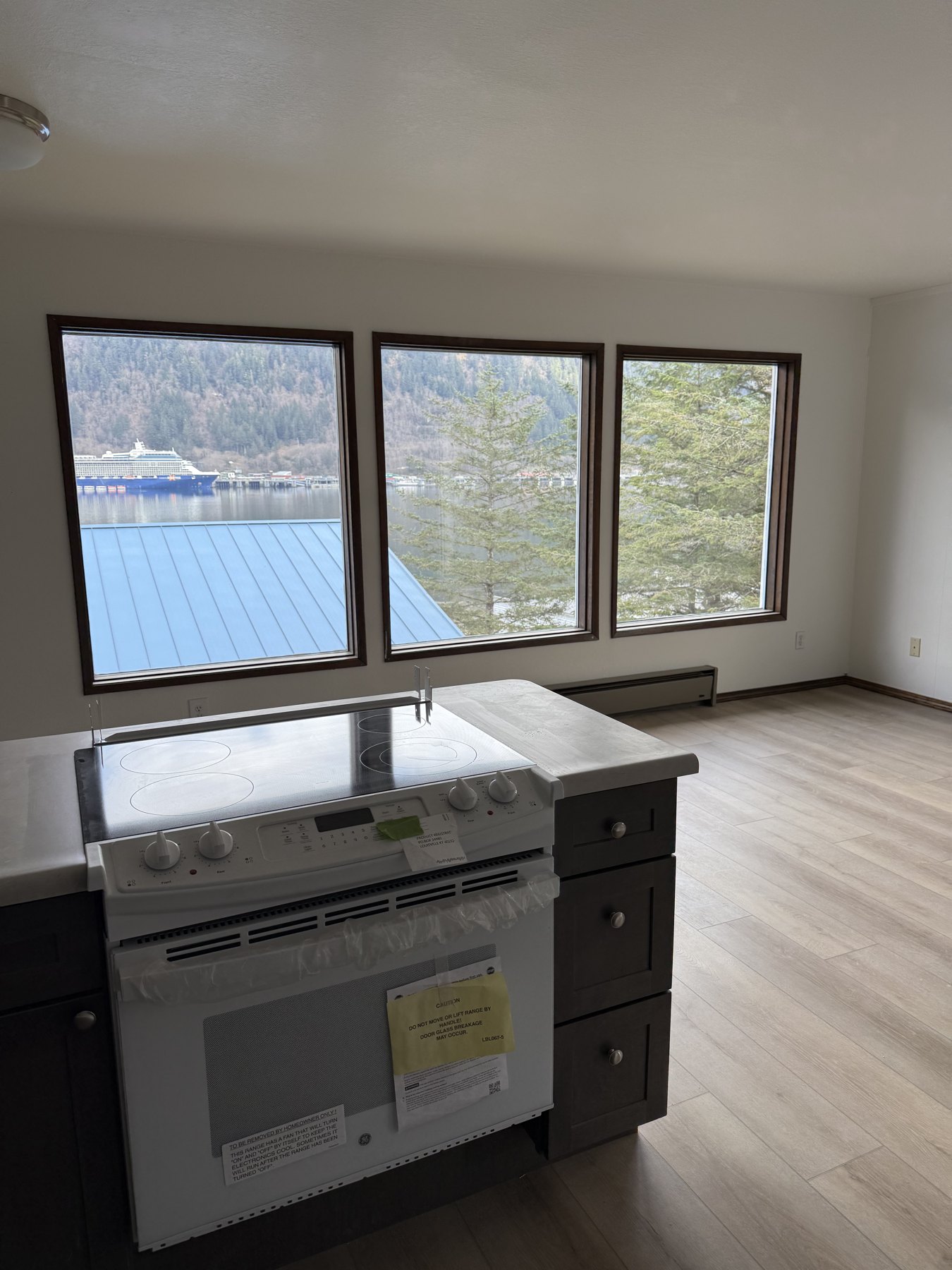 Kitchen sink and countertop beneath a wide window