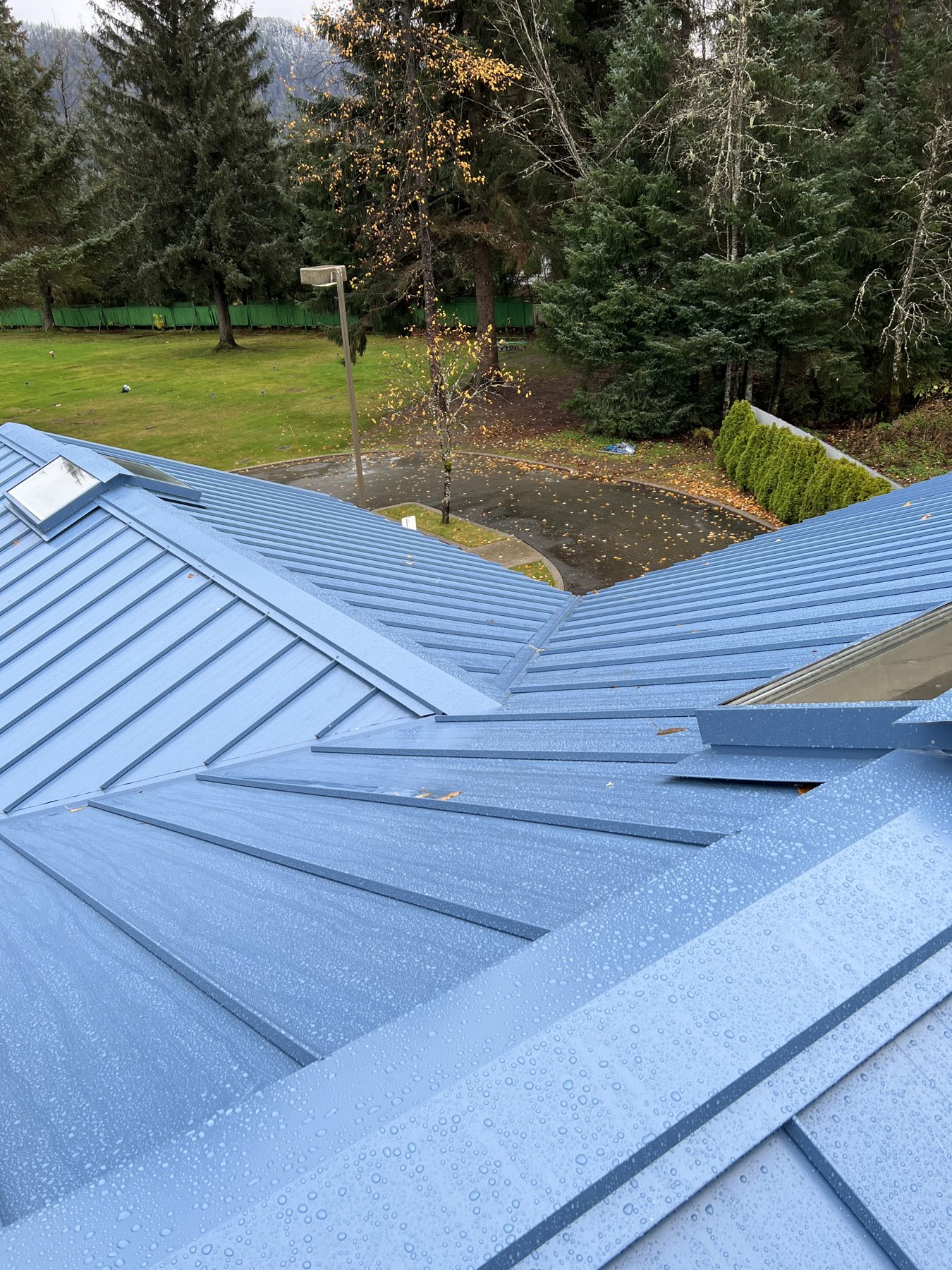 Metal roof valleys and panel connections