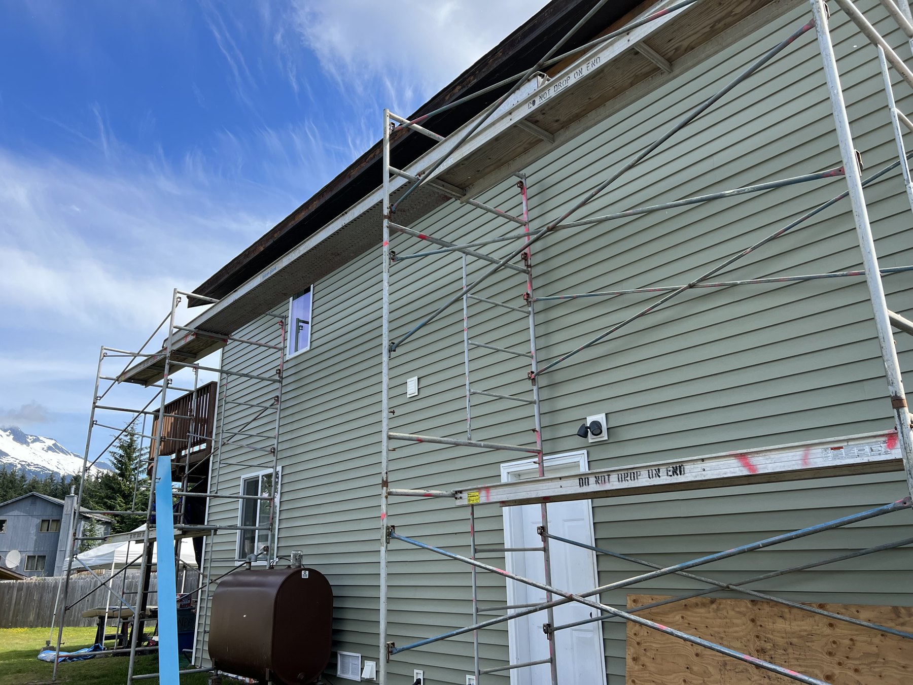 Exterior siding work with scaffolding