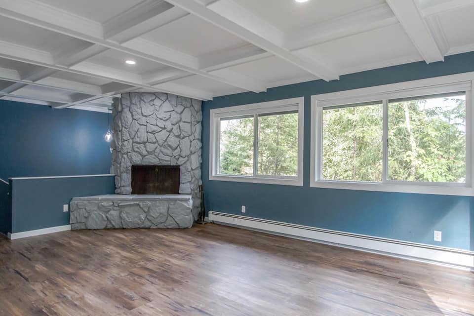 Completed interior remodel with stone fireplace and new flooring