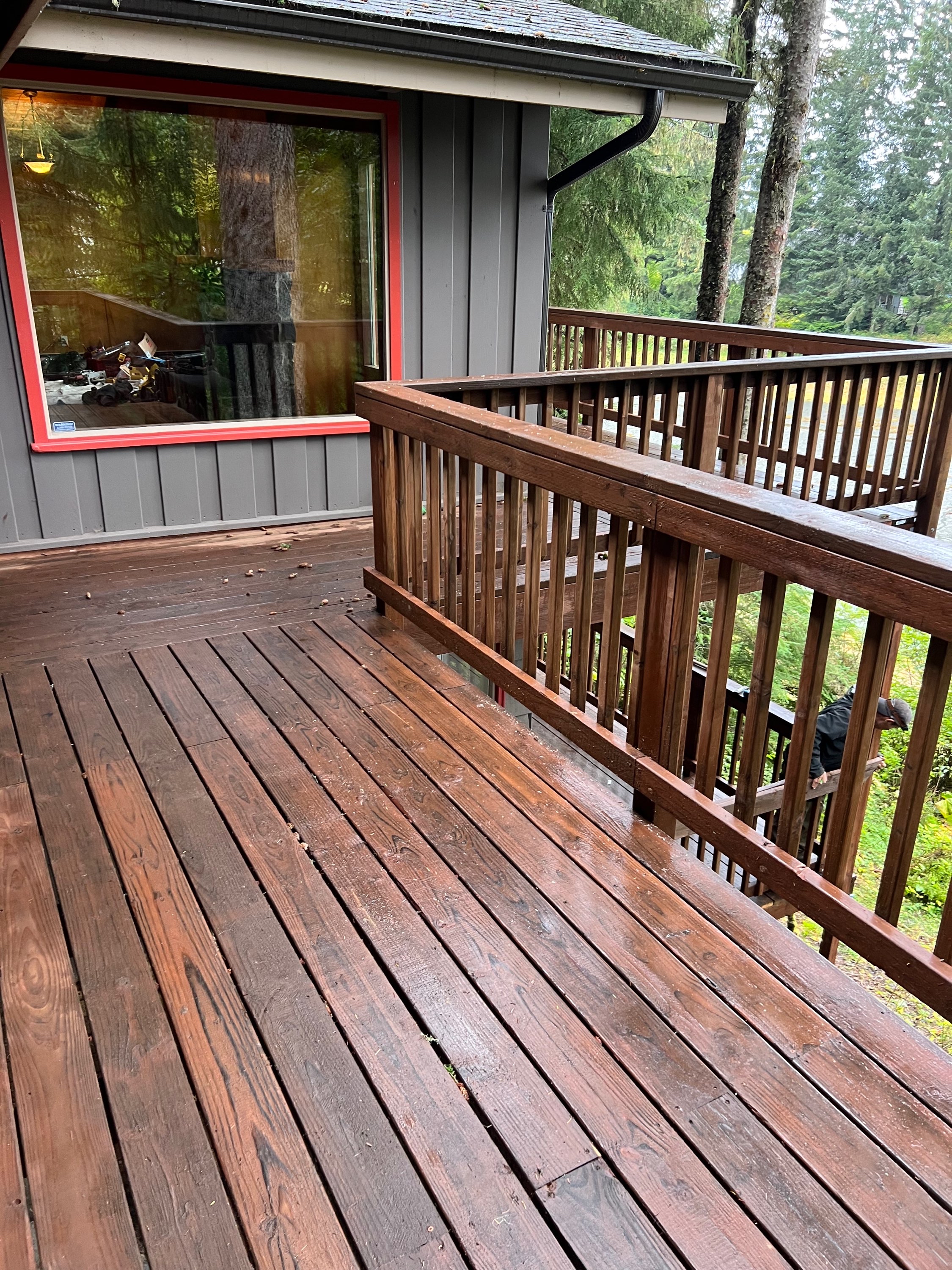 Wood deck and railing work at a wooded Juneau home