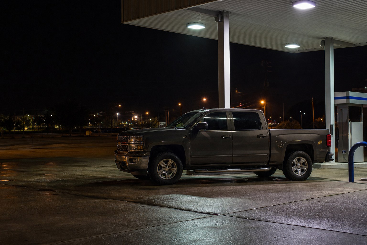 Pickup parked safely at a gas station after a clicking no-start