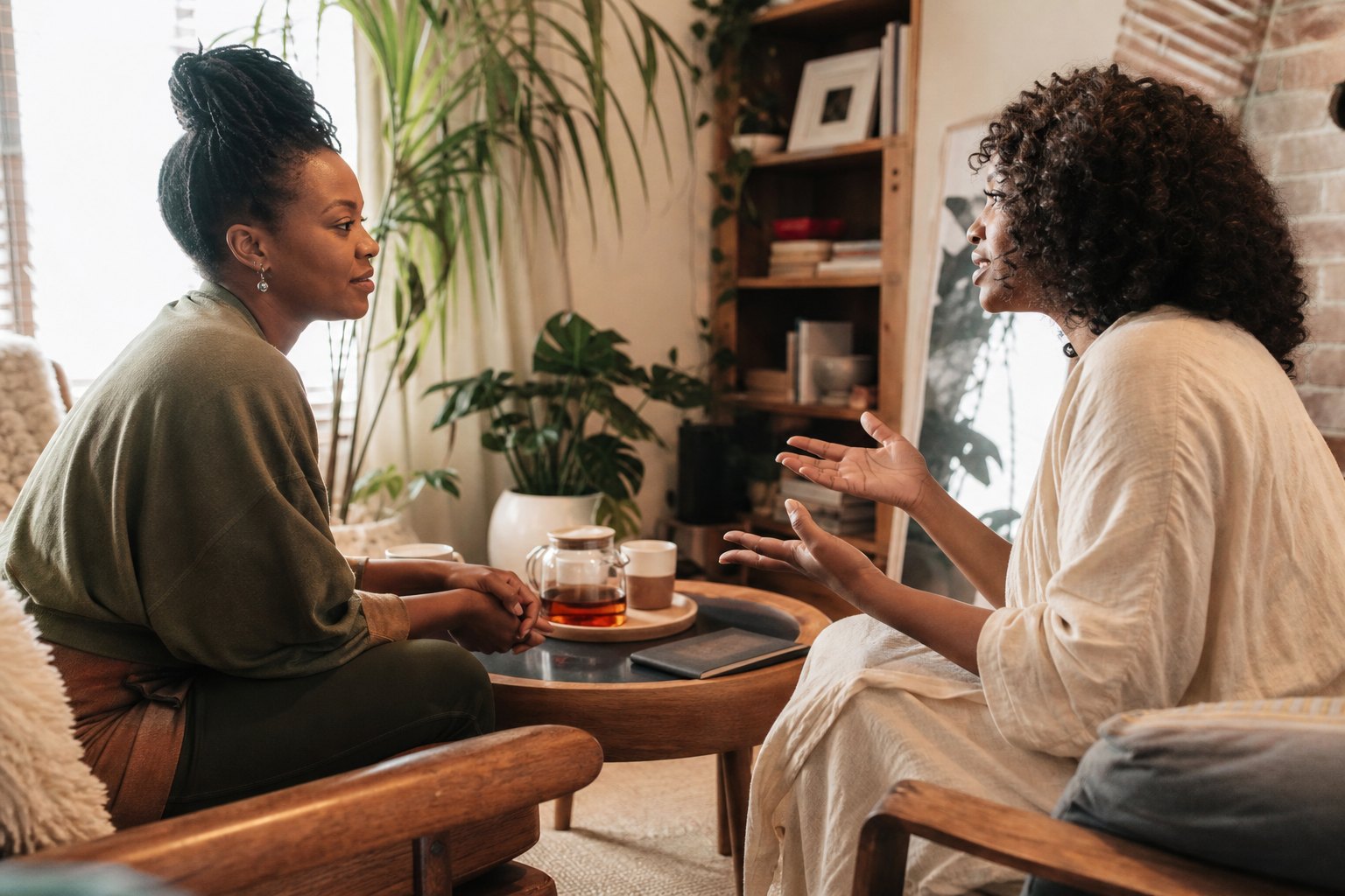 Two women having a warm conversation over tea