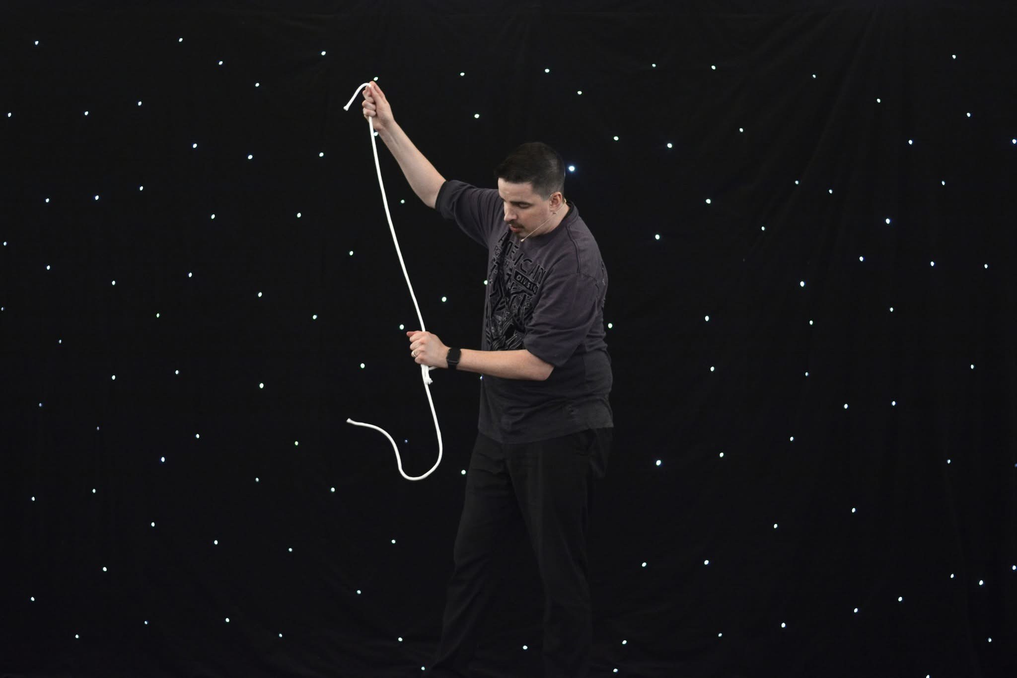 Neal Chamberlain performing a visual rope routine during a library magic show