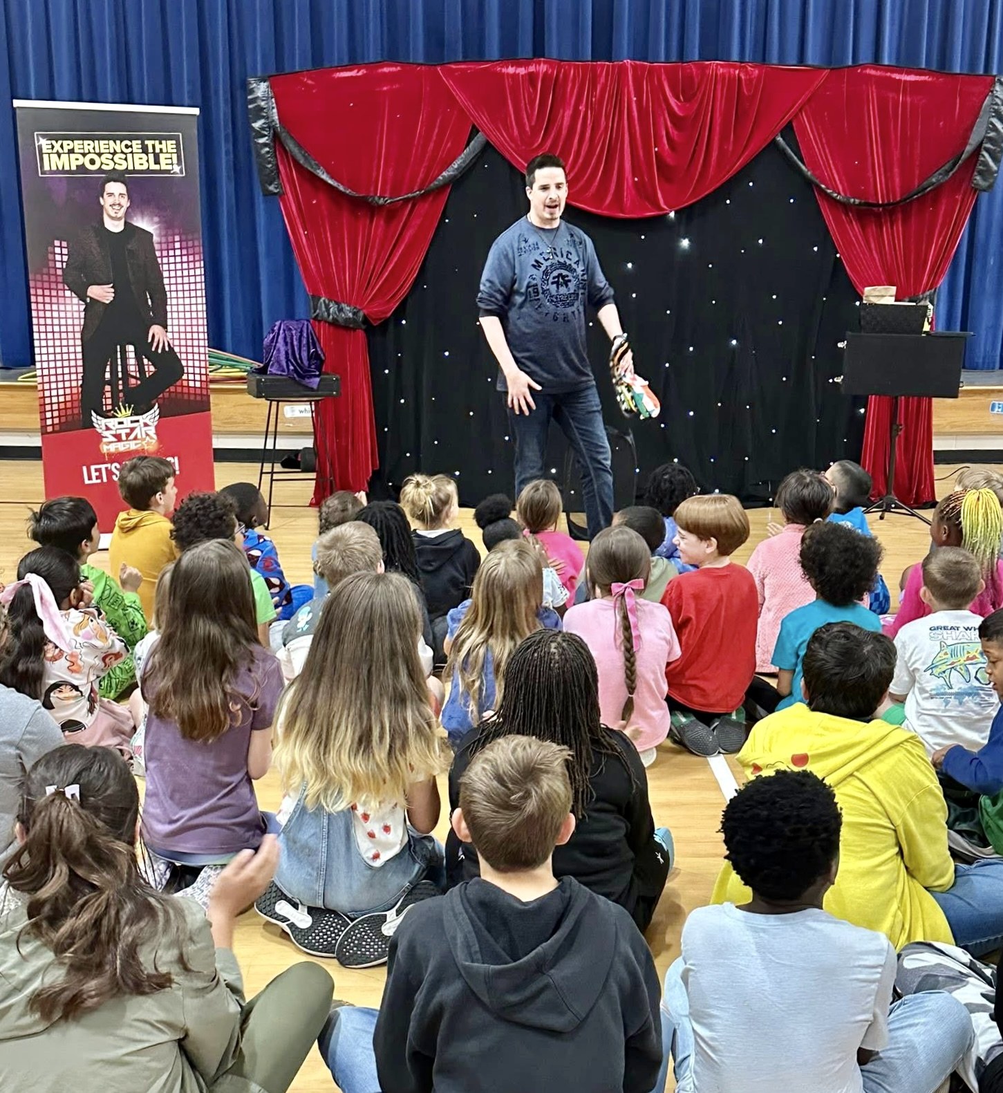 Neal Chamberlain performing for an engaged school audience