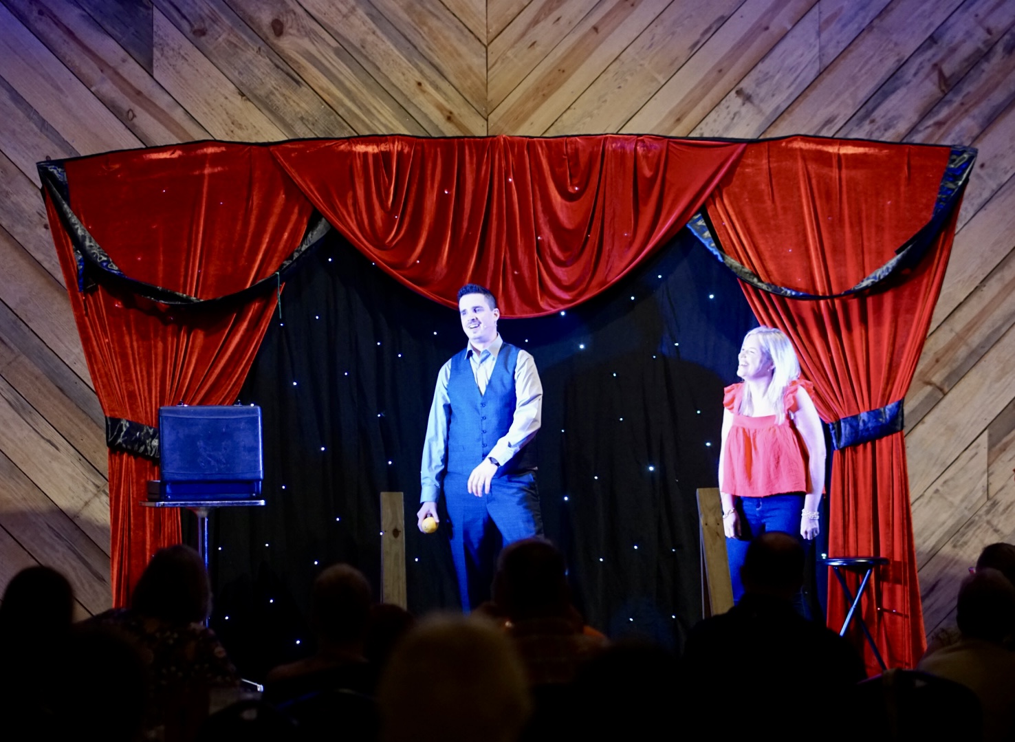 Neal Chamberlain performing on stage at a theater