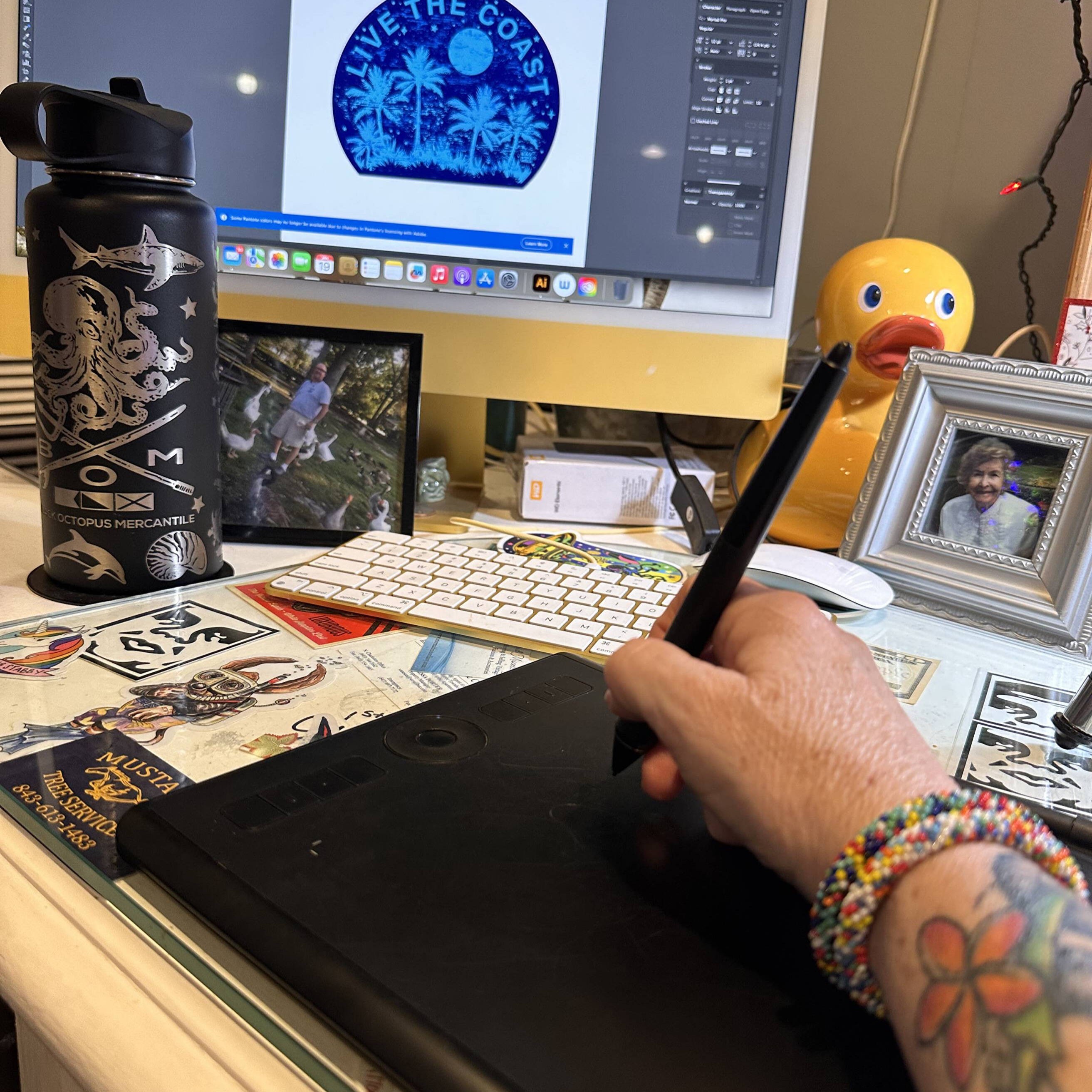 Artist drawing a Black Octopus design