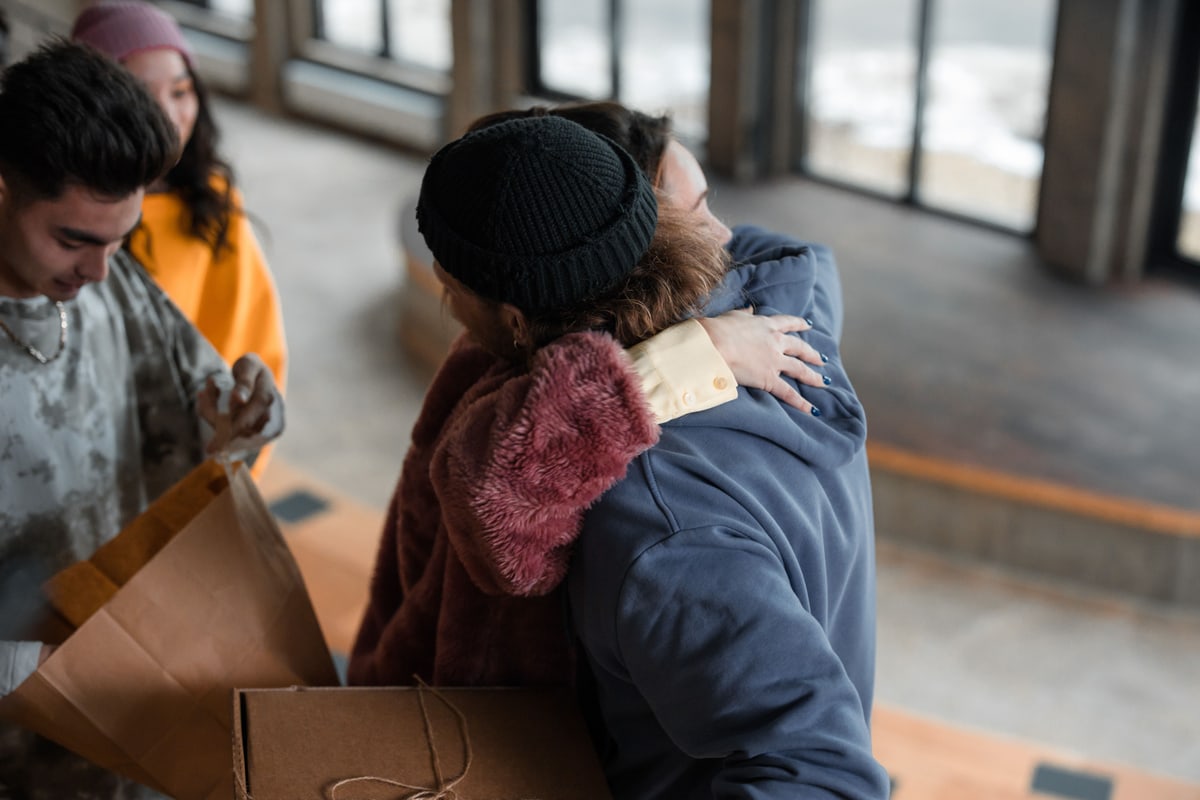 Two people sharing a warm goodbye hug