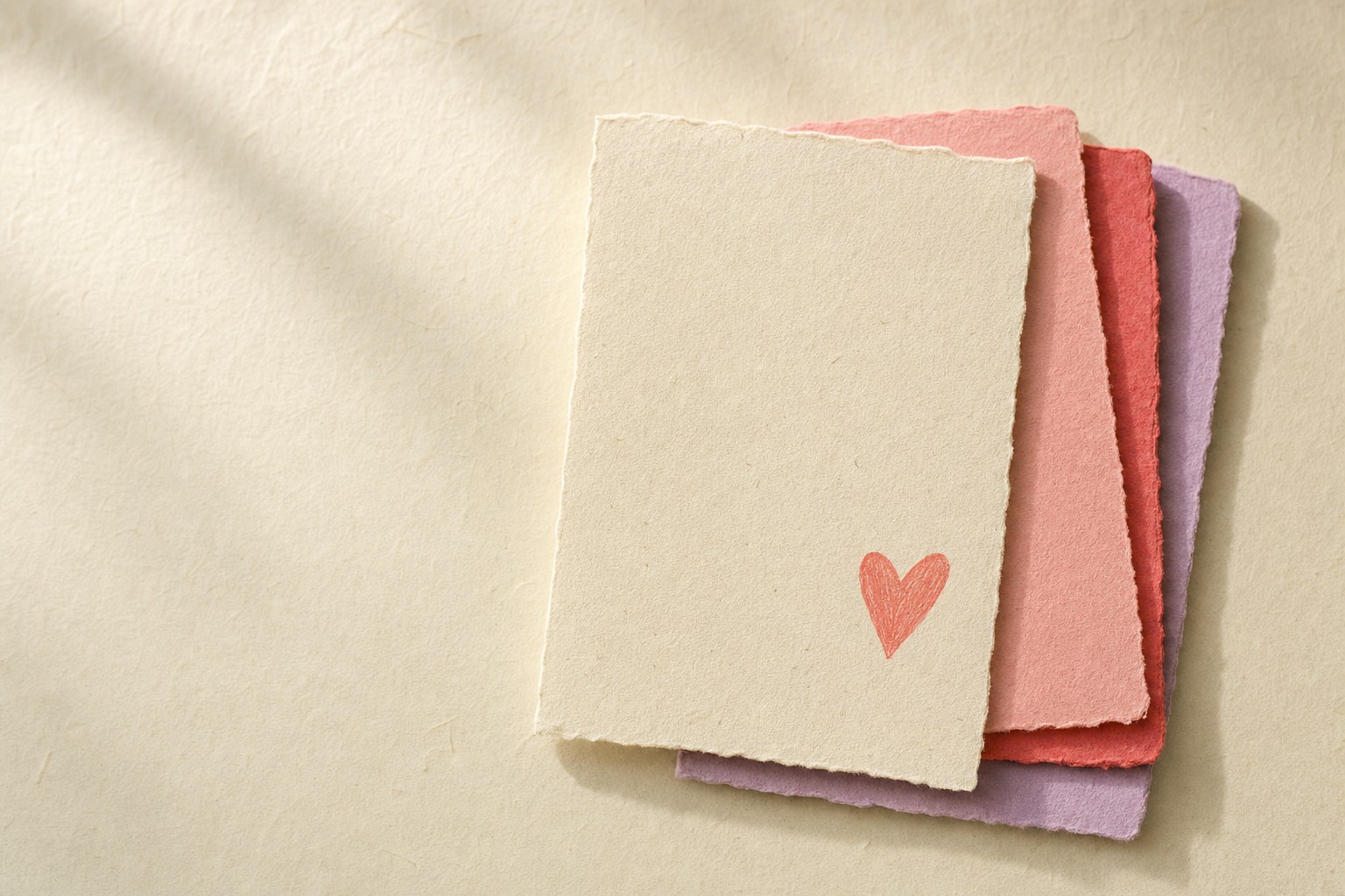 Layered textured notes in coral, pink, red, and lilac
