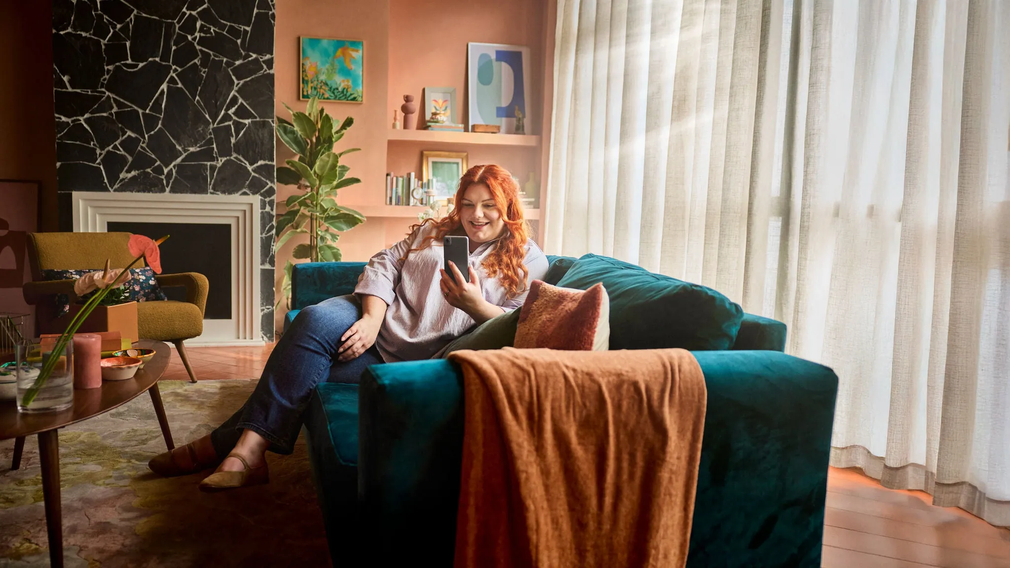 Woman relaxing at home and using a smartphone