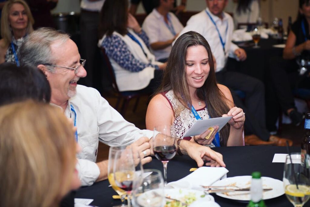 Business professionals talking at a networking event