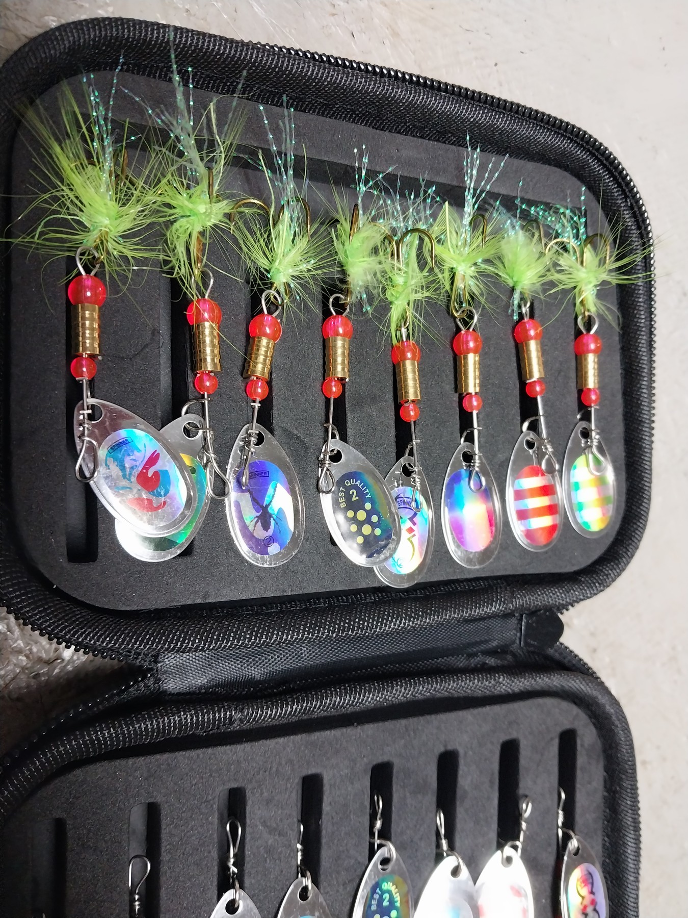 Top row of spinner baits in the pouch