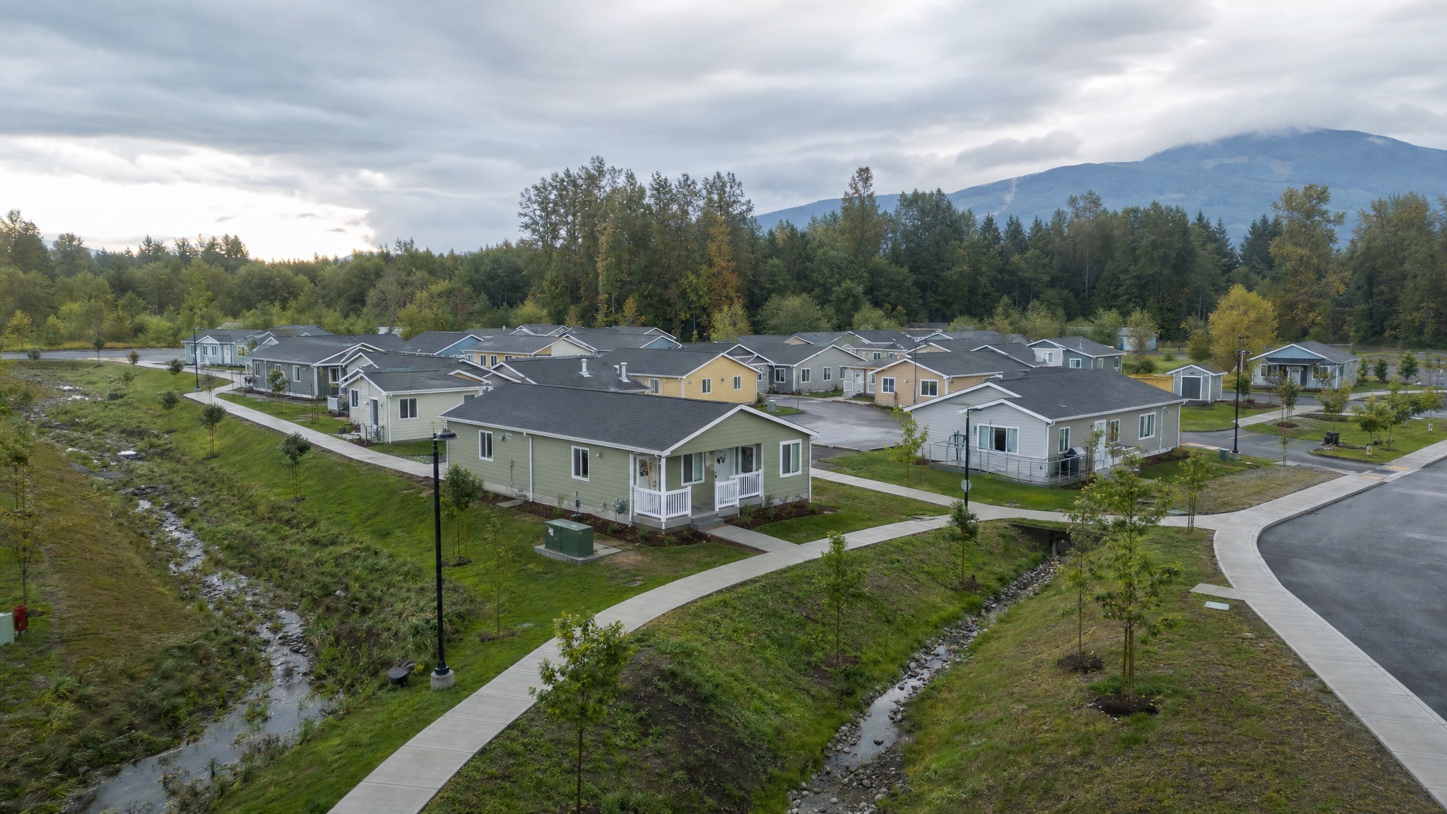 Completed recovery housing community with accessible paths and drainage