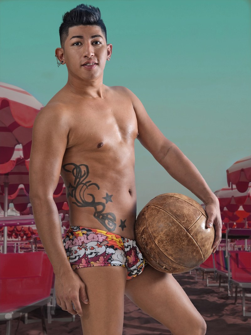 Model wearing CecilAndEzra square cut swim trunks