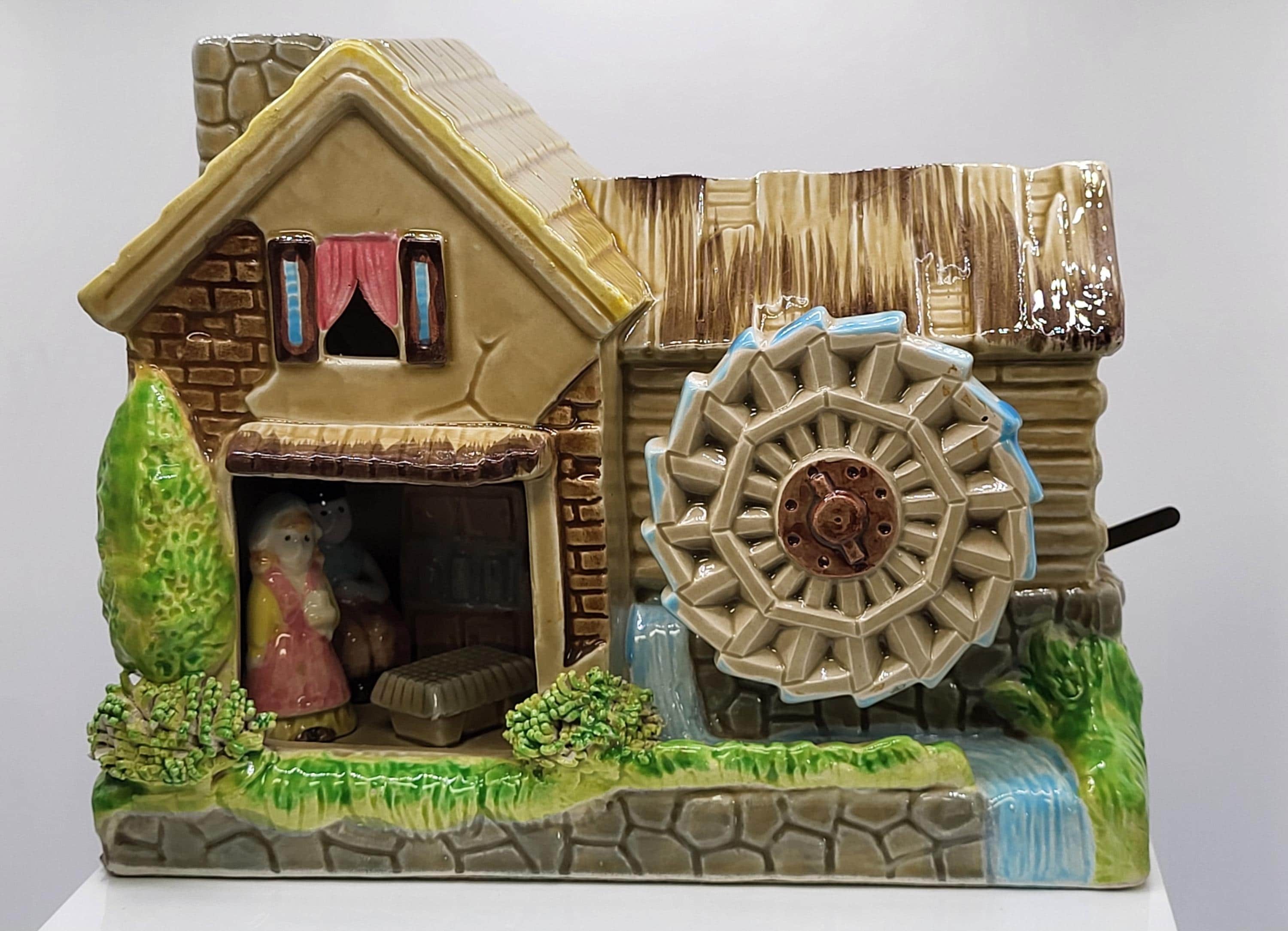 Vintage All Porcelain Cottage Scene with working waterwheel porcelain music box with Shadowbox of couple inside.