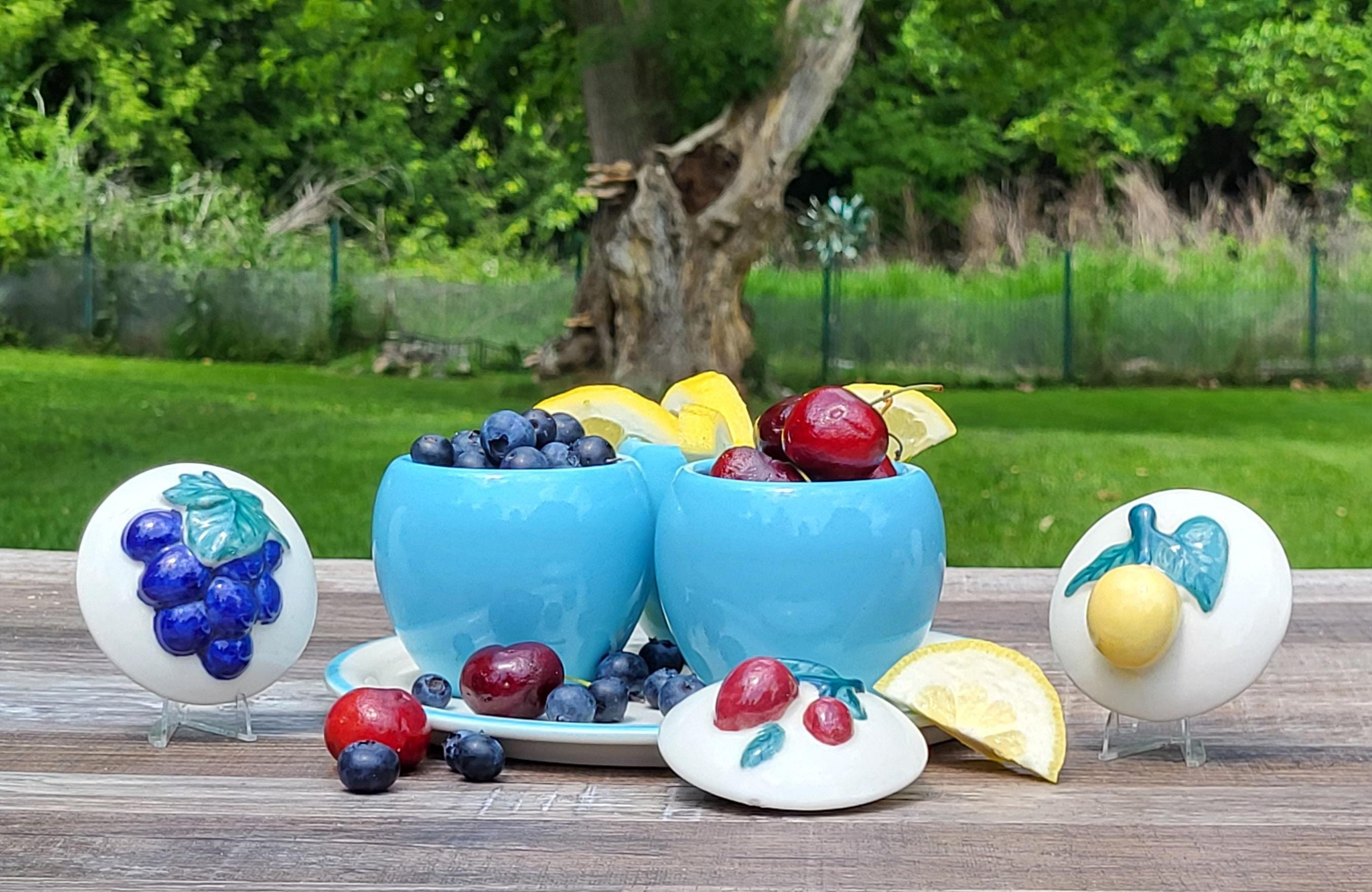 Set of three vintage, MCM jelly/jam jars sitting on a serving plate. Made by Abingdon. view 3