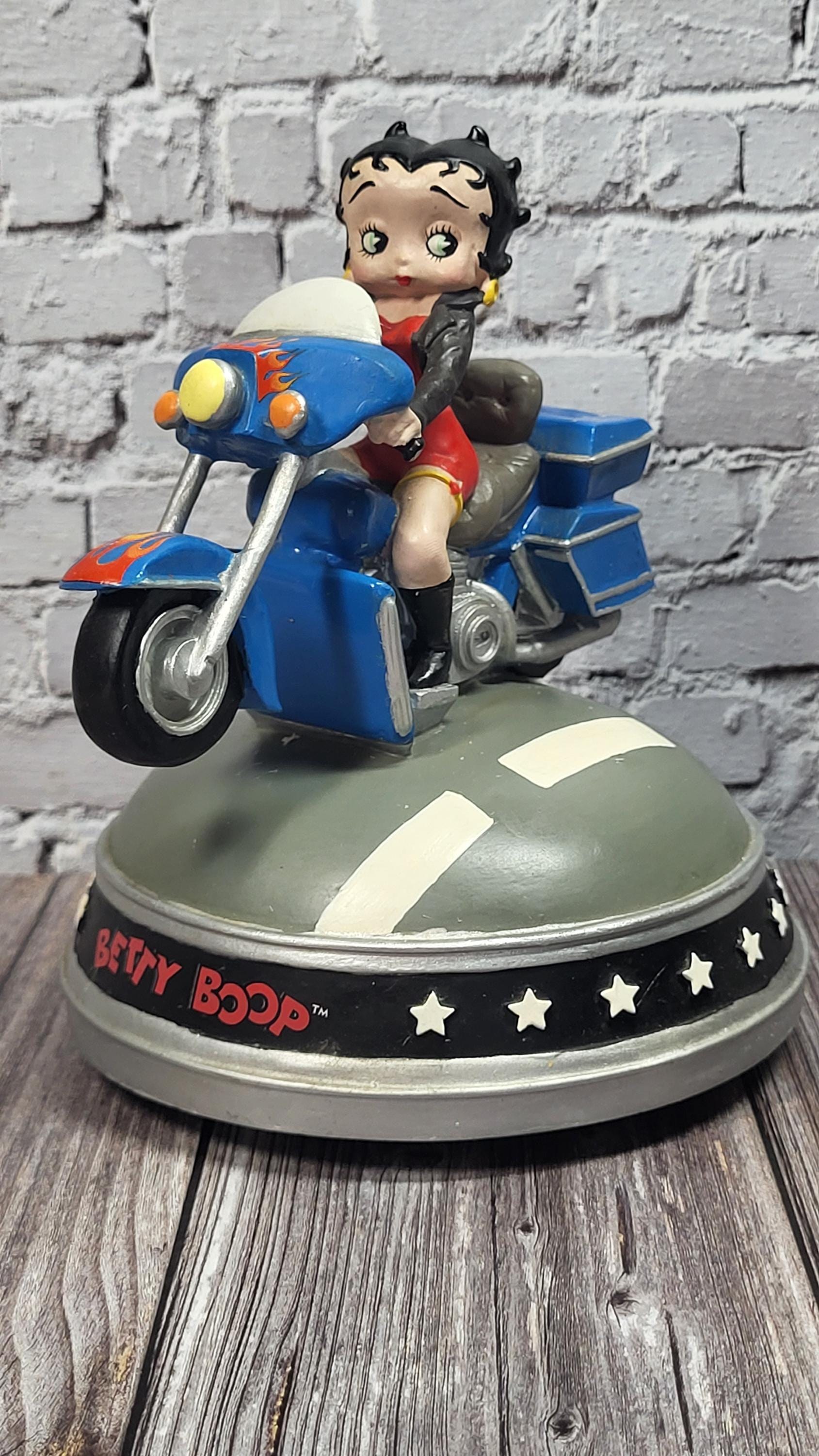 A Symphony of Motion and Melody: The Pristine, New-in-Box Betty Boop Motorcycle Musical Figurine Plays On the Road Again!