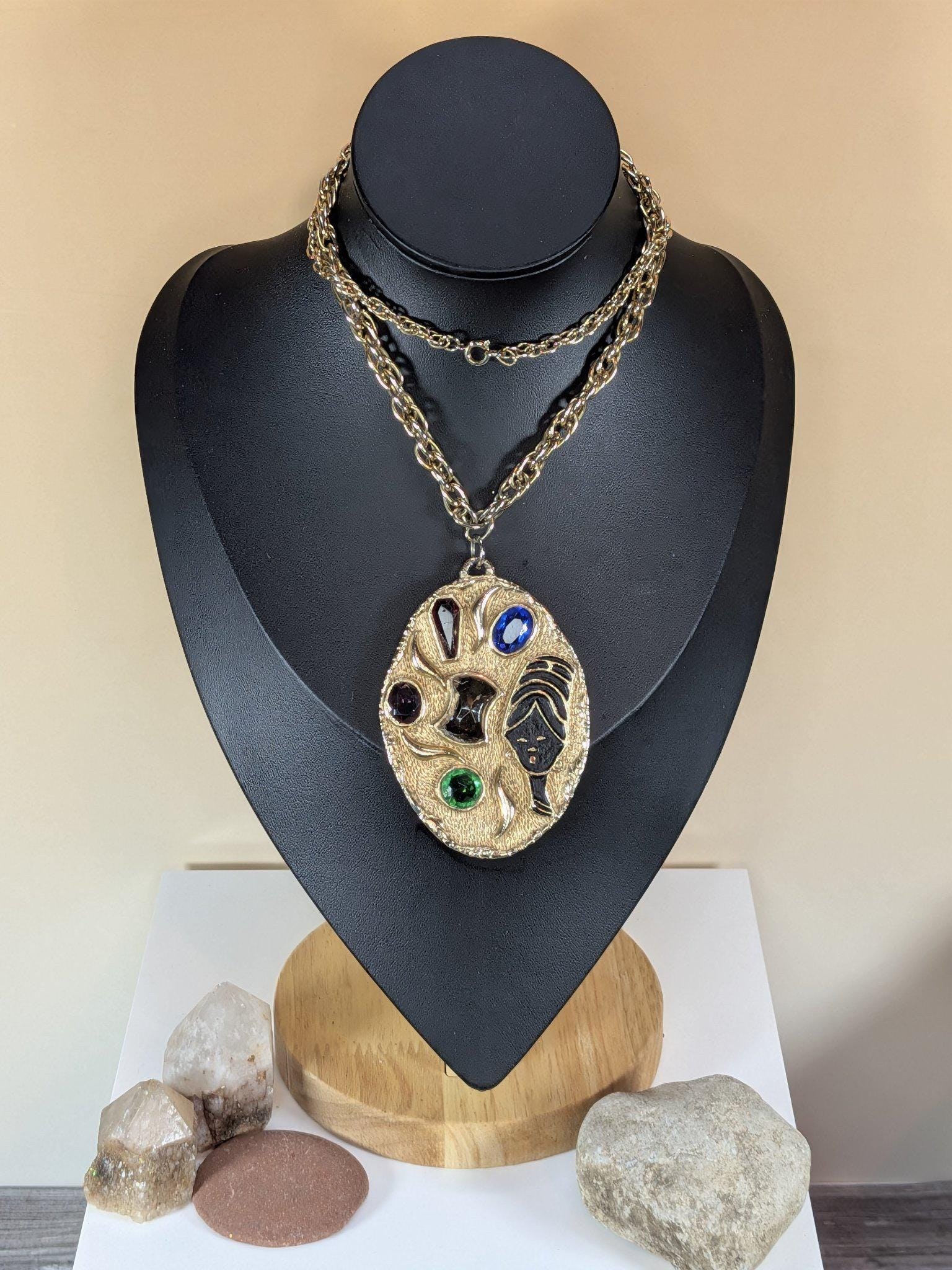Vintage gold tone figural statement pendant necklace, enamel face, colorful cabochon stones