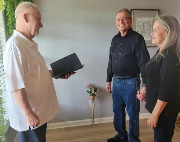 Edward leading an intimate indoor ceremony
