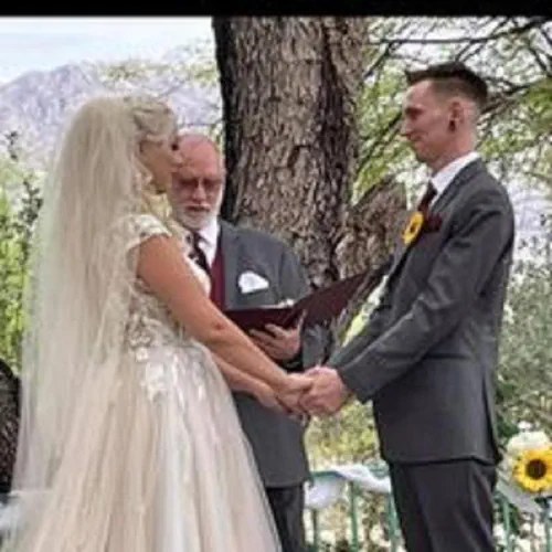A couple exchanging vows outdoors