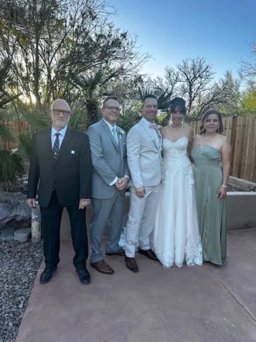 Newlyweds celebrating with their wedding party