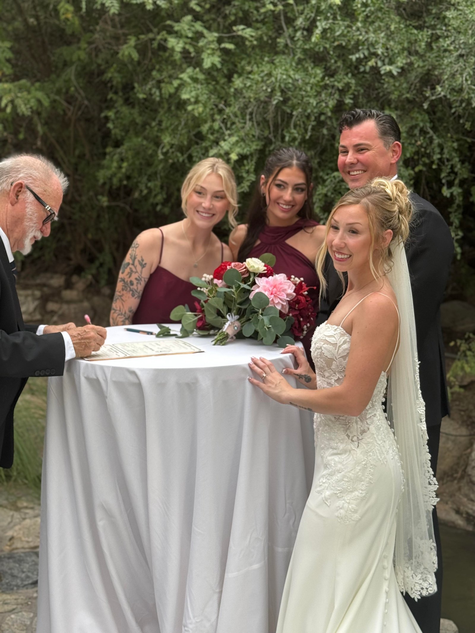 Edward signing the marriage license with the Hunter wedding party
