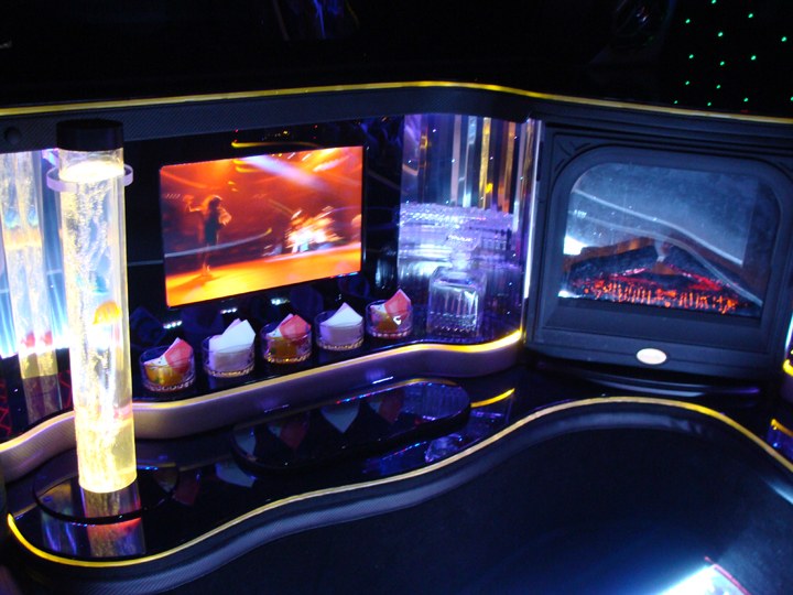 Illuminated bar inside a Limo Scene Hummer limousine