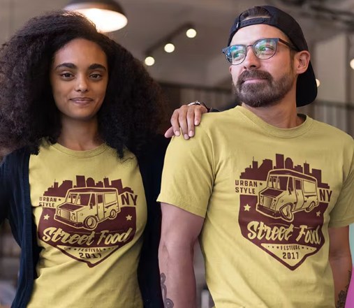 Two people wearing yellow Street Food Festival T-shirts