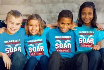 Children wearing blue custom event T-shirts