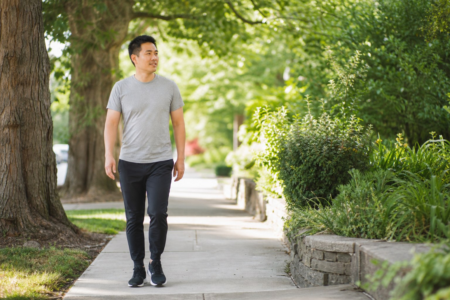 Adult taking a comfortable walk on a leafy neighborhood path
