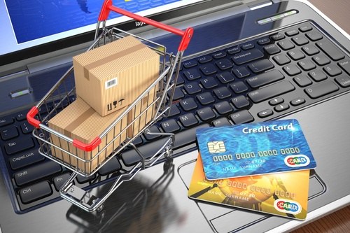 Shopping cart with packages and payment cards