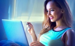 Woman completing an application on a laptop