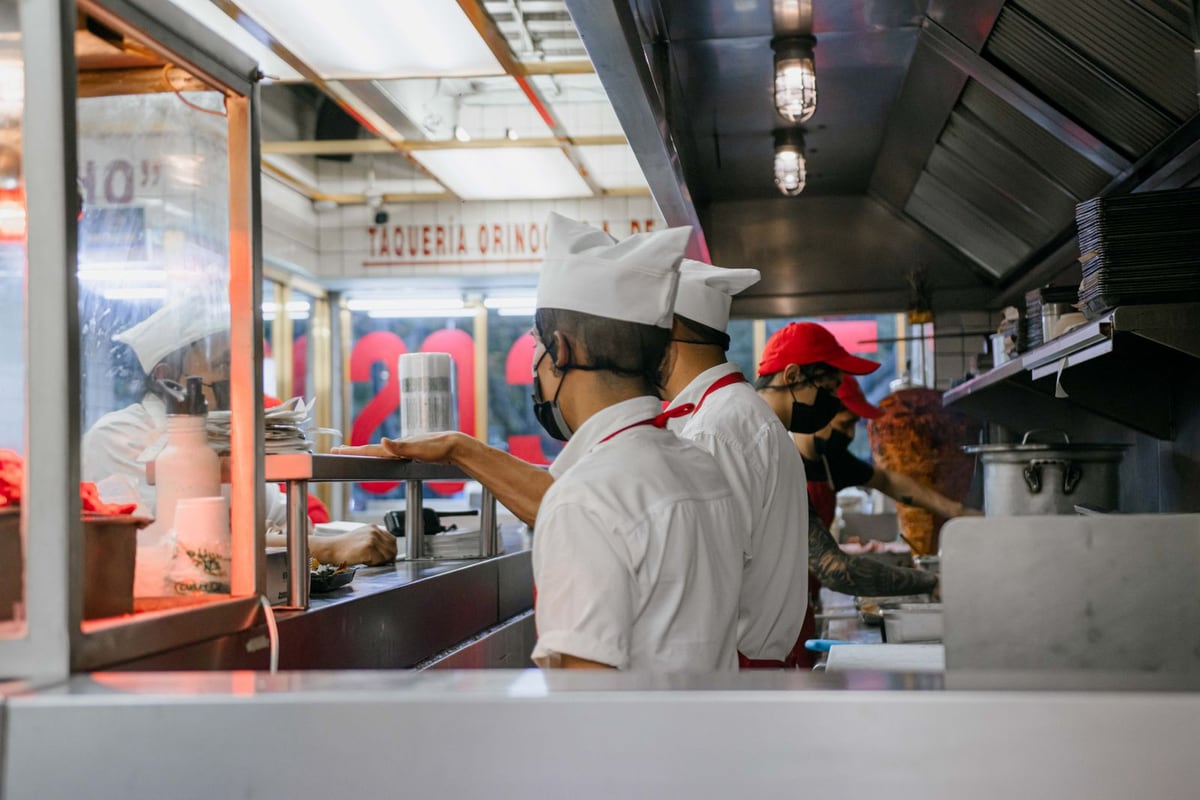 Restaurant team preparing food in a kitchen