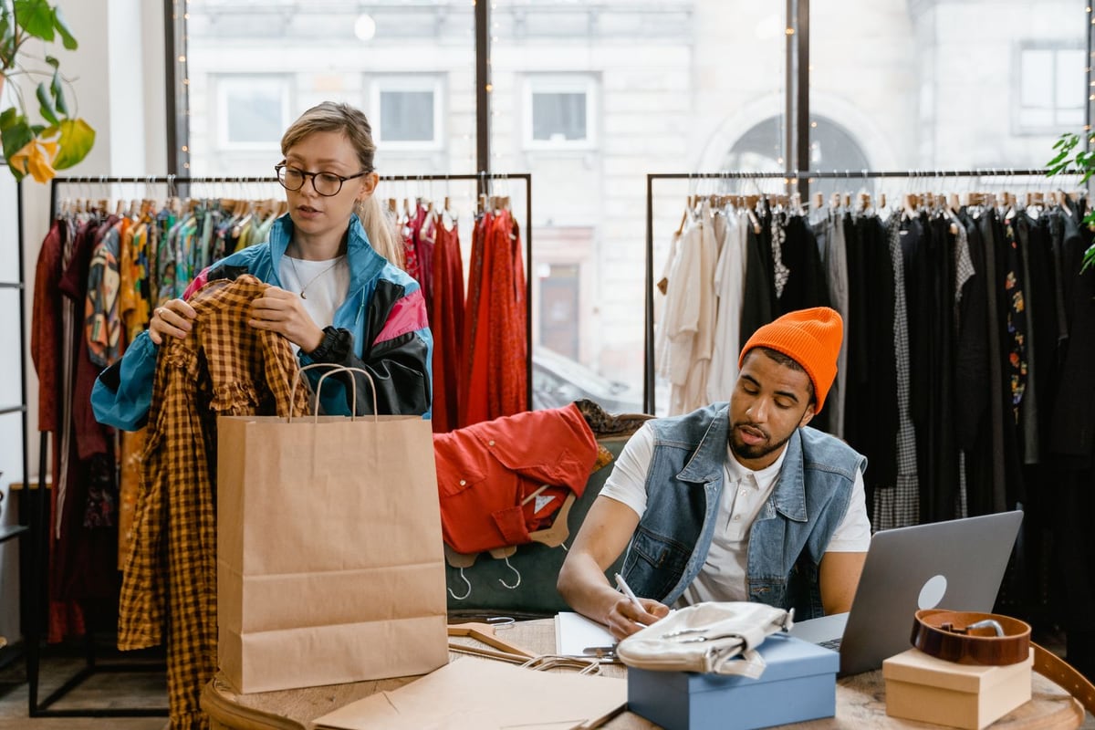 Retail shop team organizing merchandise
