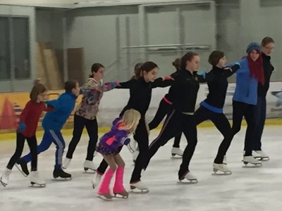 A group of Bremerton Figure Skating Club skaters on the ice