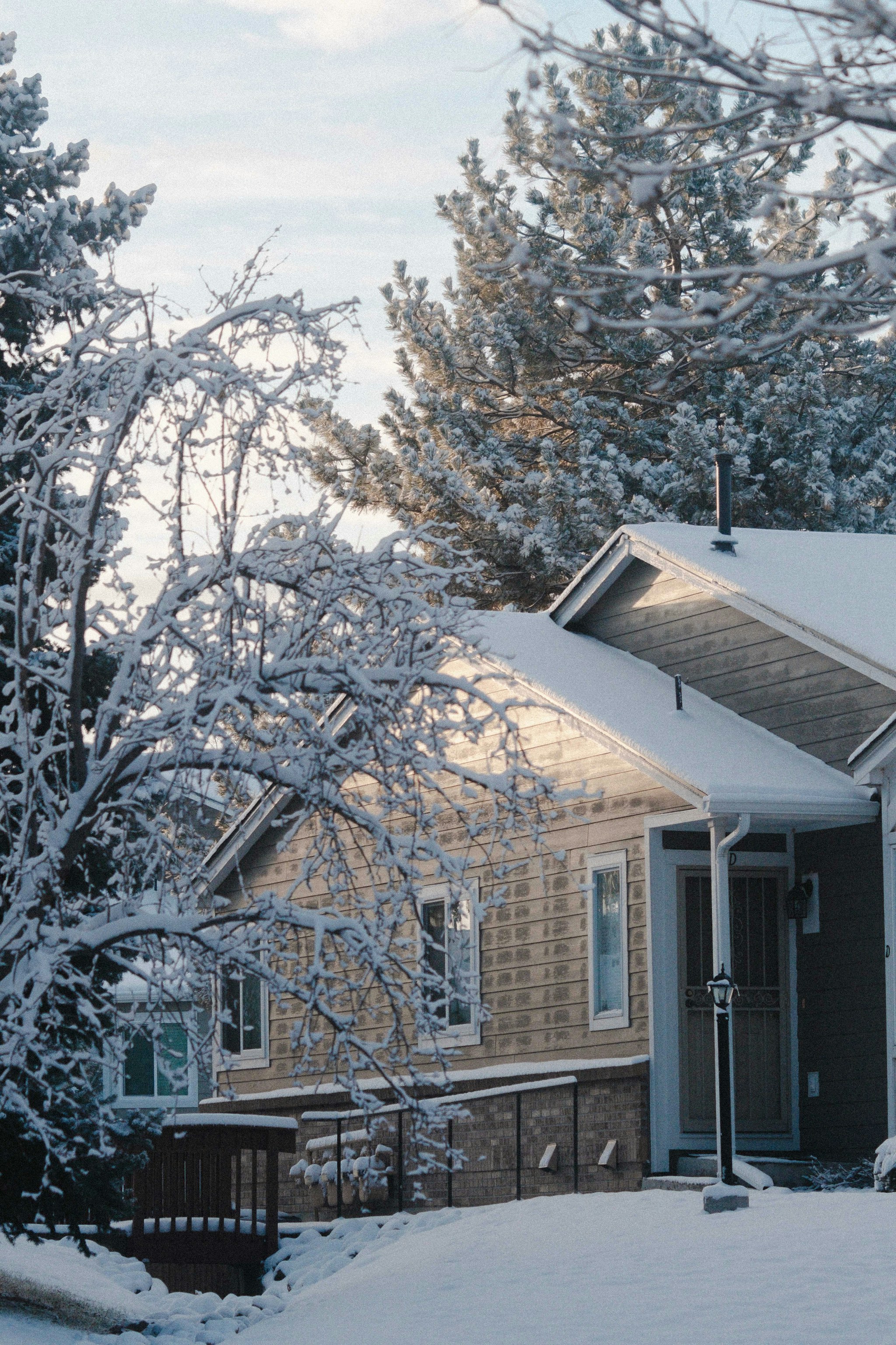 Snow-covered home during a calm winter morning