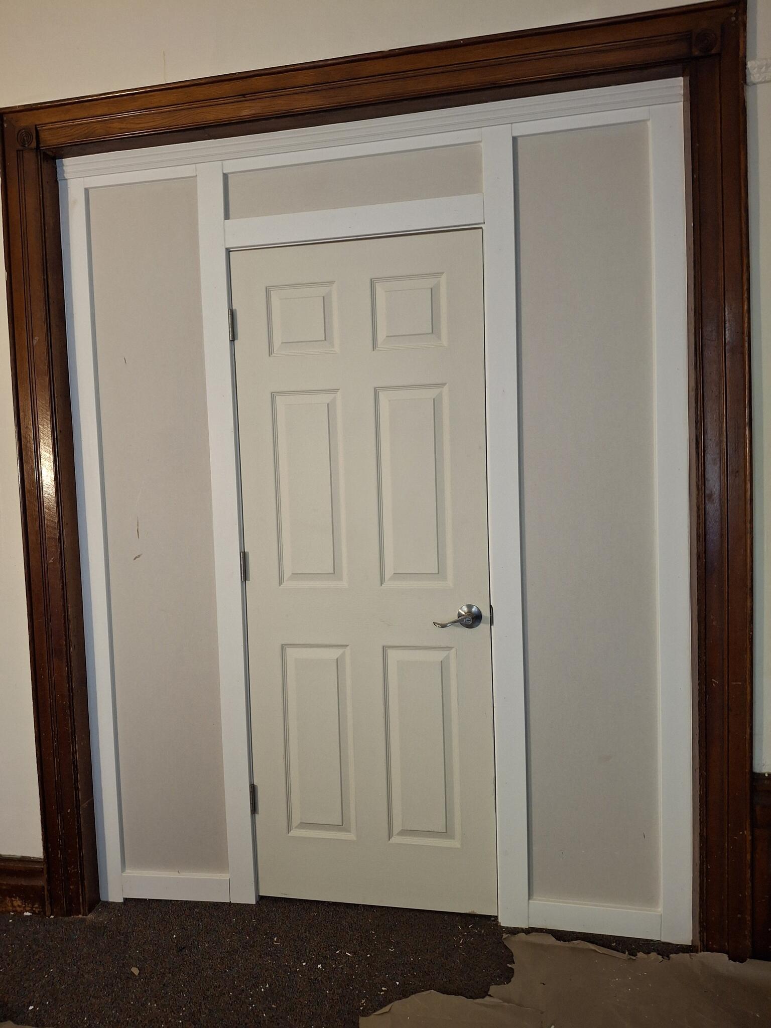 Installed interior door and finished trim
