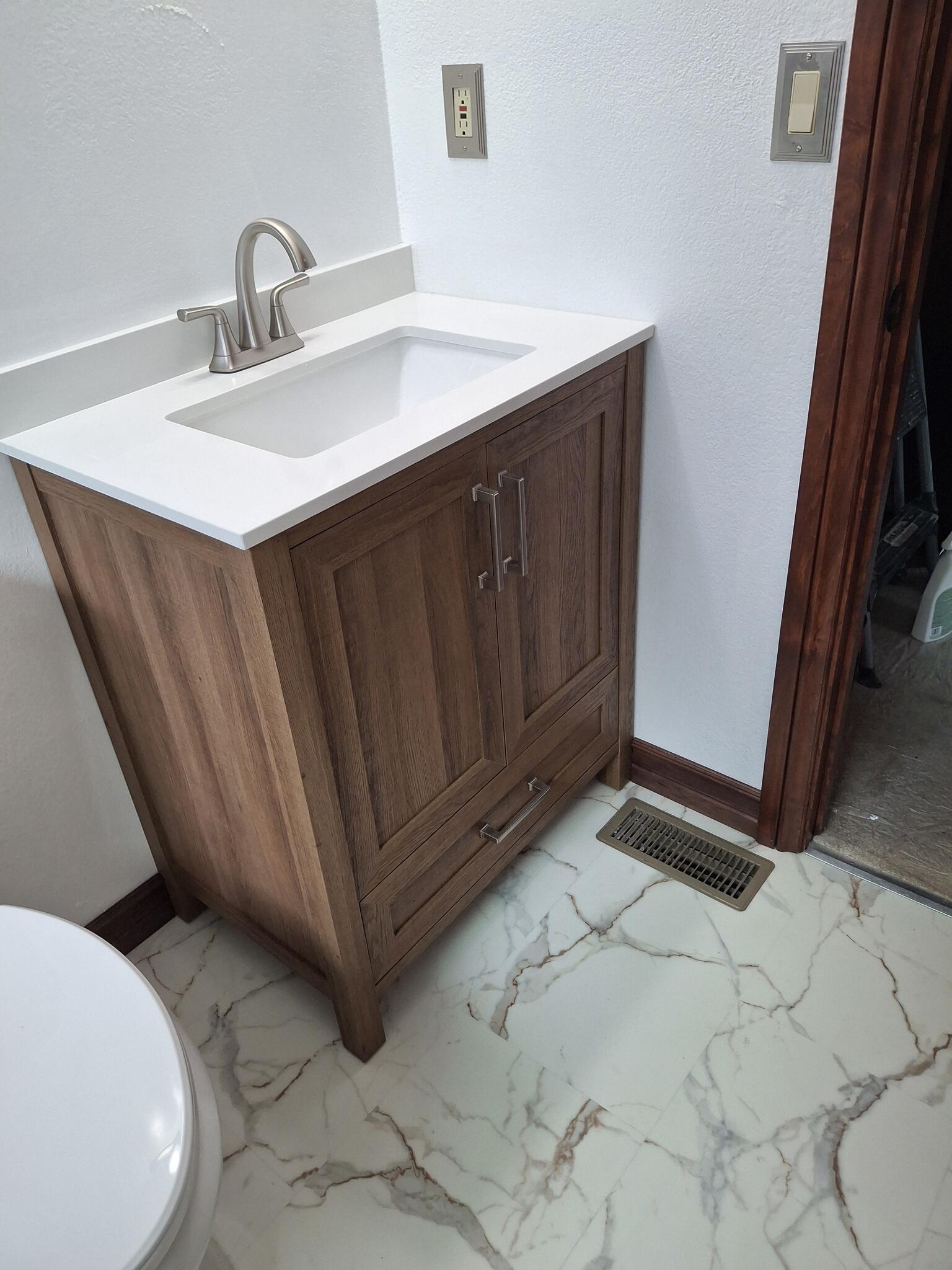 New vanity and marble-look flooring