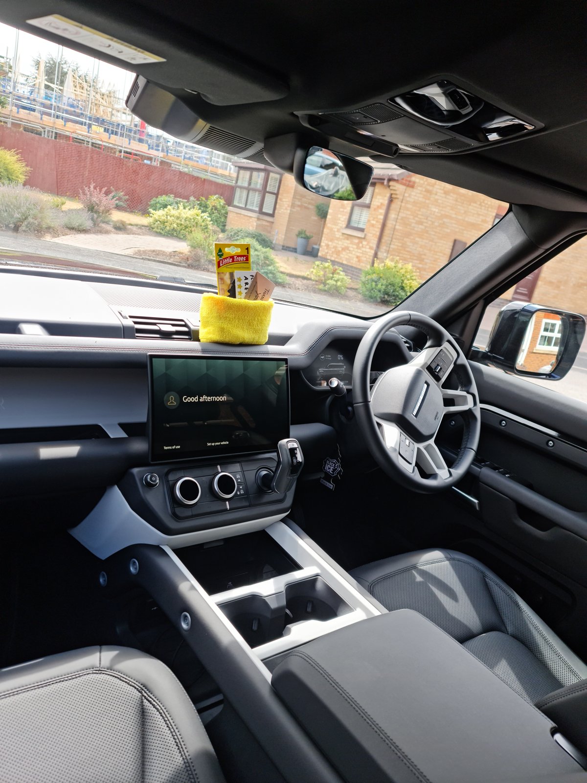 Detailed vehicle cabin with clean seats, dashboard and centre console