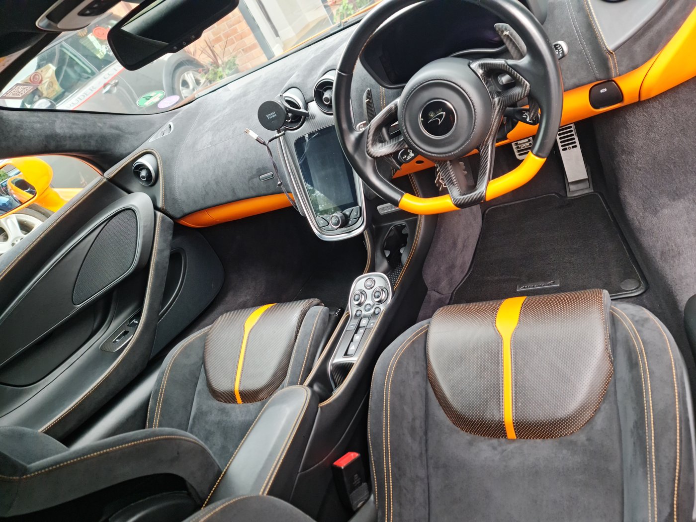 Close-up of the McLaren seats, steering wheel and centre console