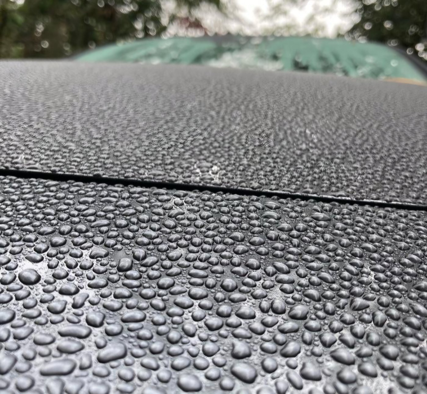 Water beading across a vehicle bonnet after protection