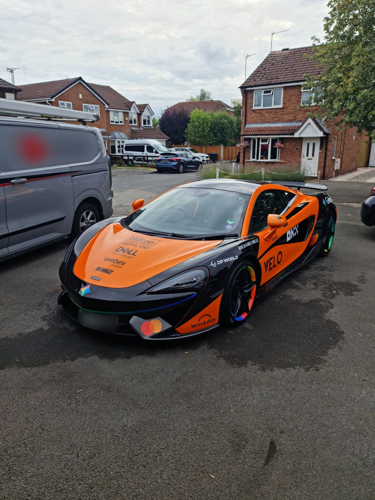 Orange and black McLaren viewed from the front after detailing