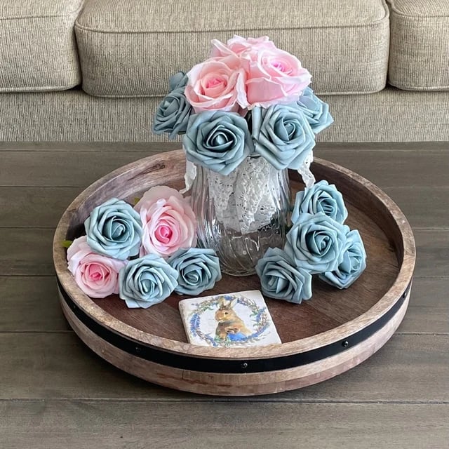Blue and pink flower pens displayed in a painted jar