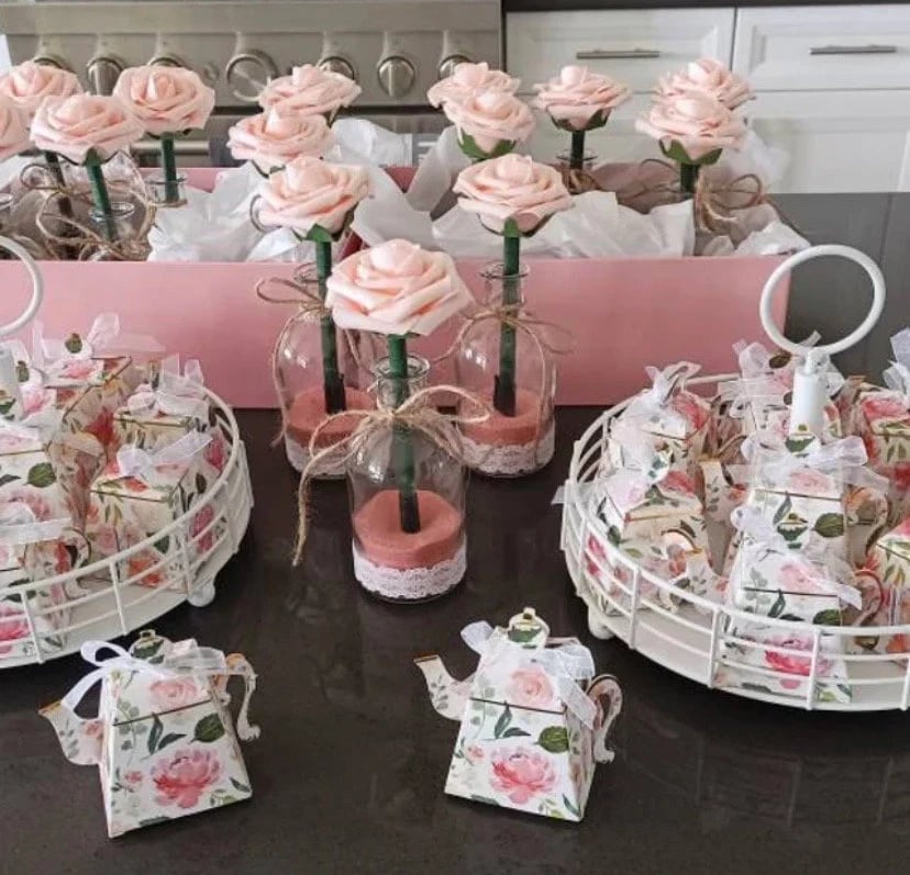 Pink flower pens arranged for a baby shower celebration