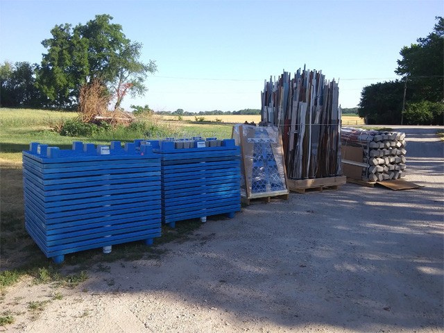 Fishiding modular habitat bases and upright material staged outdoors