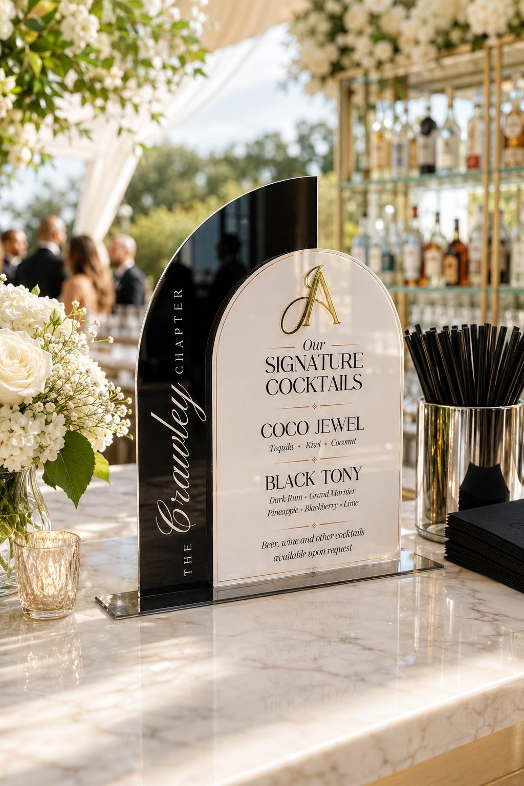 Custom celebration sign placed at an outdoor event bar