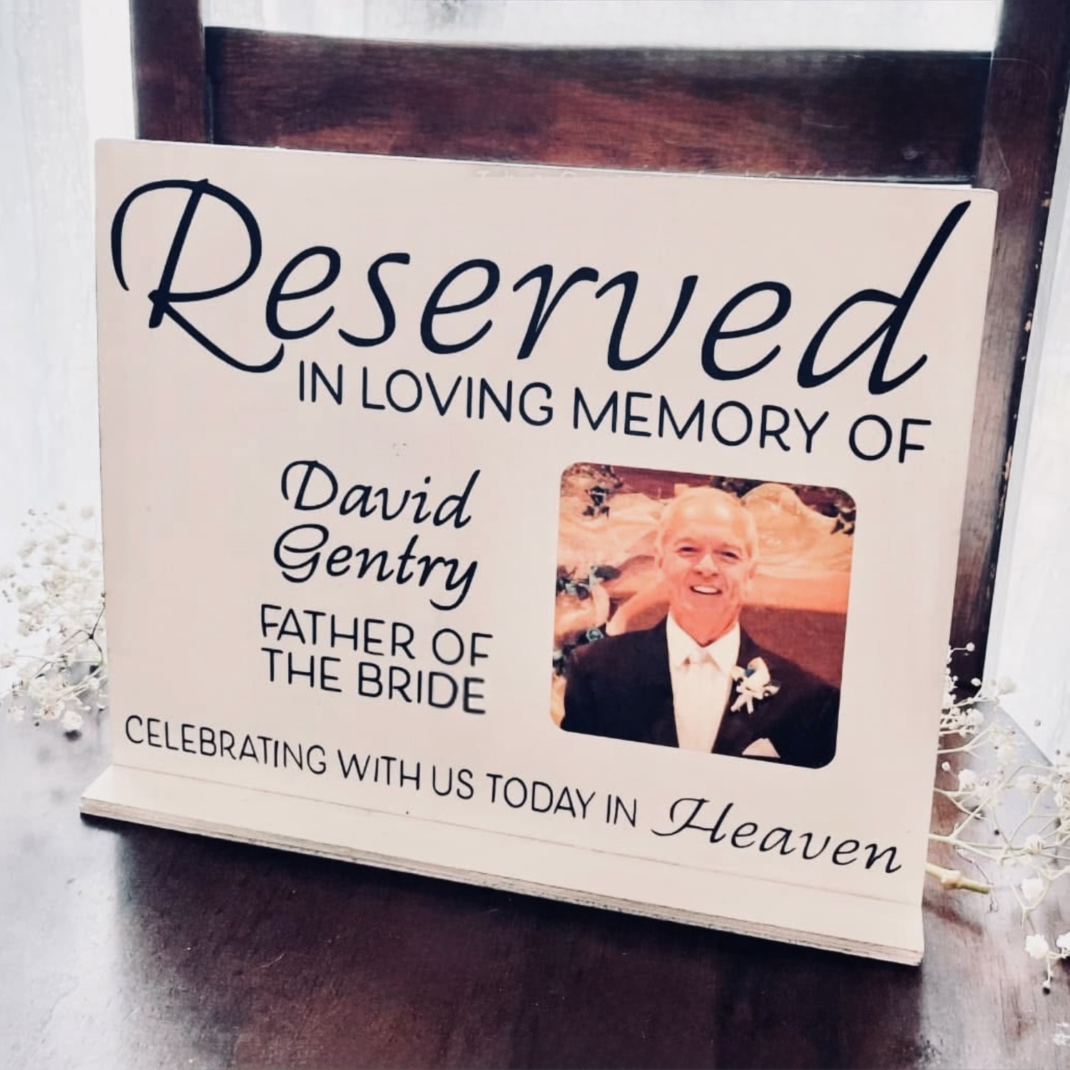 Personalized wedding memorial display with a photo honoring the father of the bride