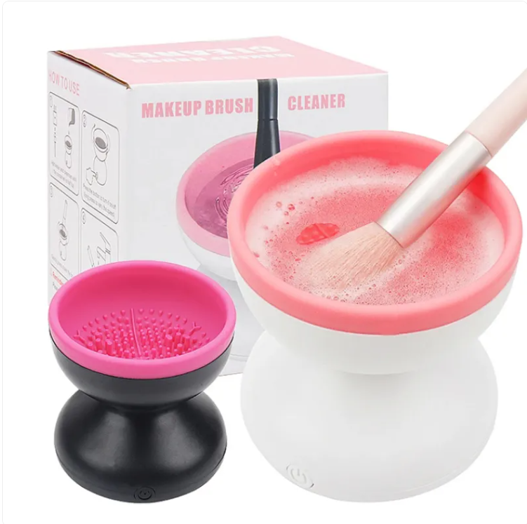 Makeup brush washer beside a silicone cleaning surface