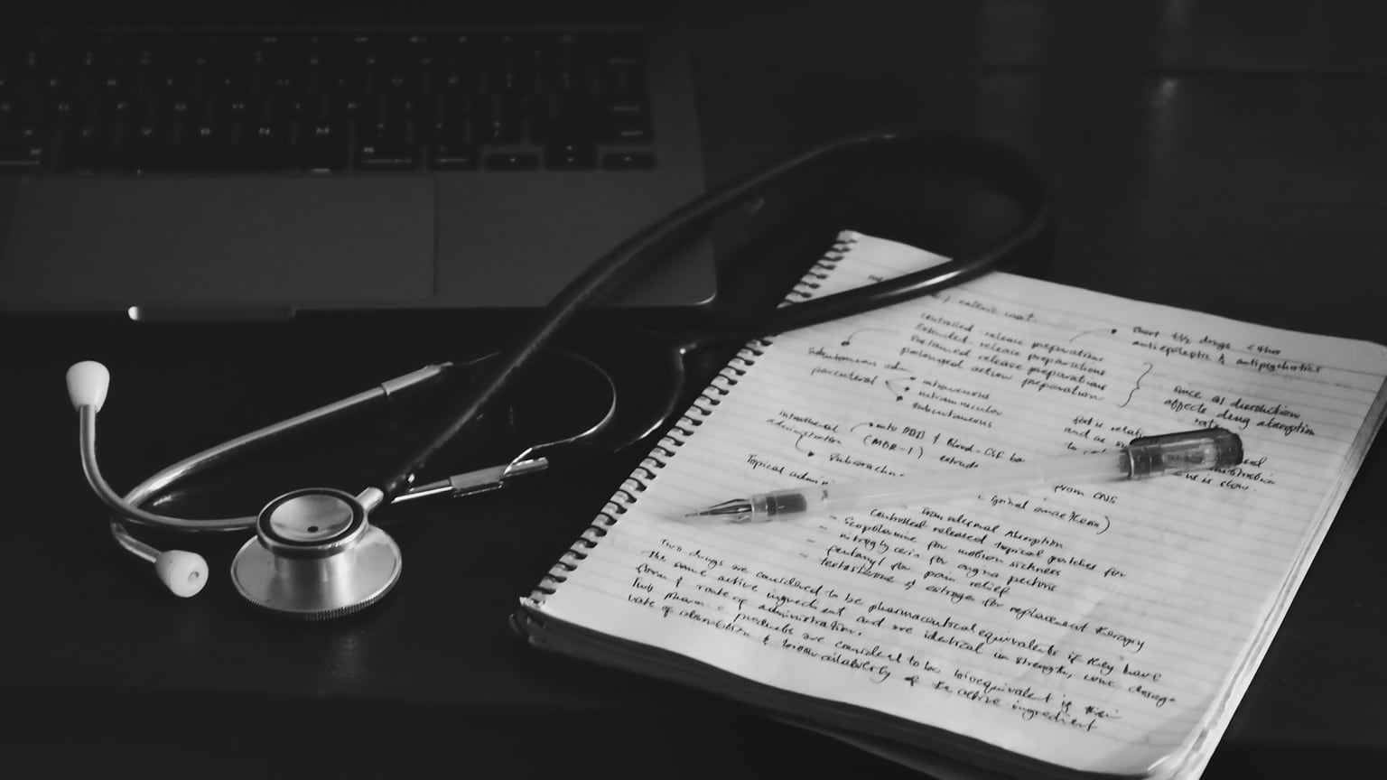Stethoscope, notebook, and pen prepared for a conversation about care needs