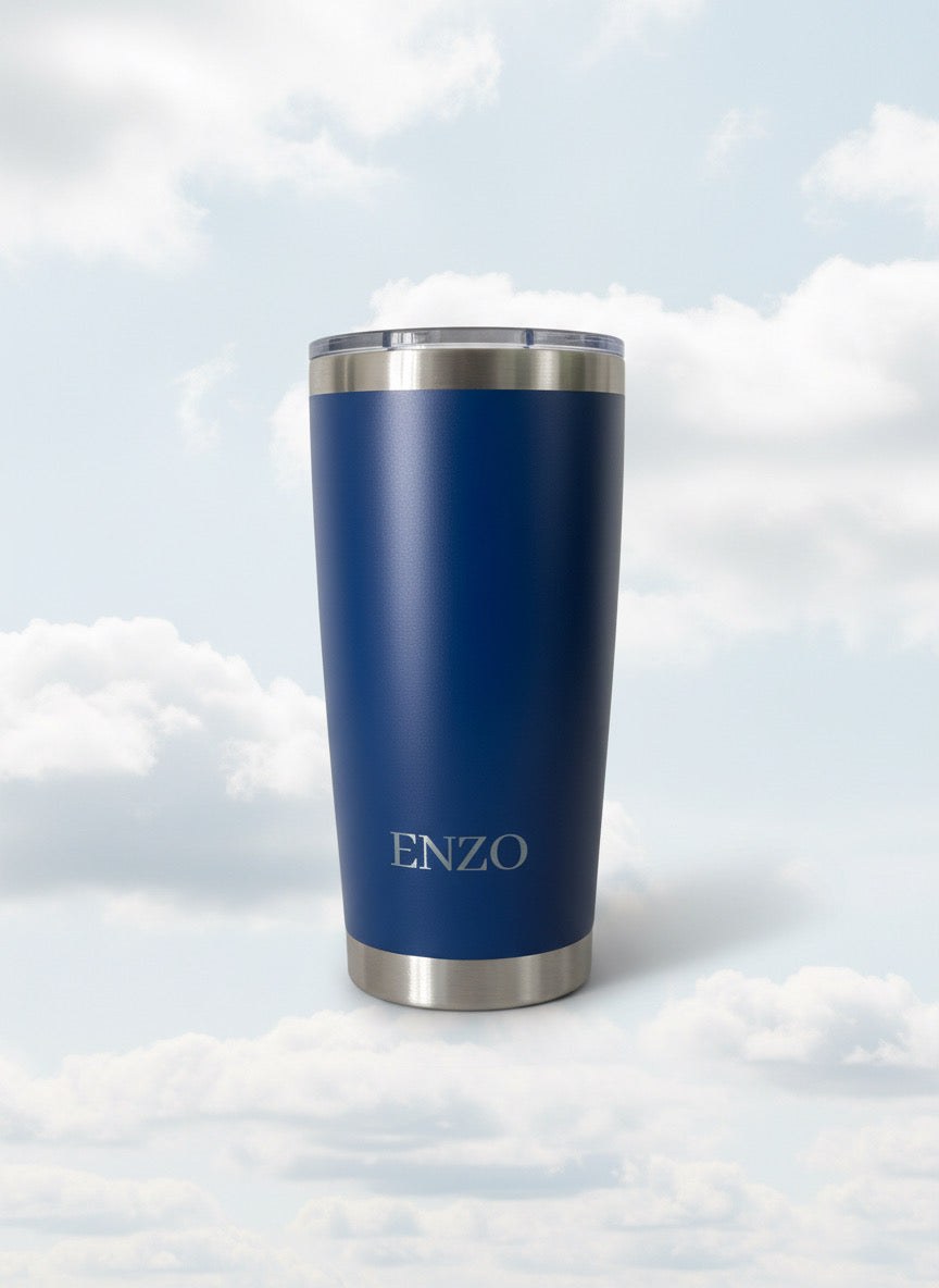 Royal Blue ENZO coffee tumbler against a cloud background